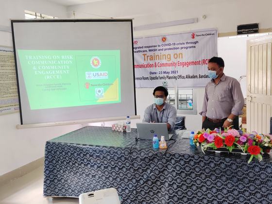 A projected title slide reading Training on Risk Communication and Community Engagement
